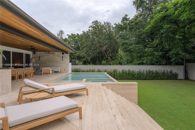 view of swimming pool with a lawn