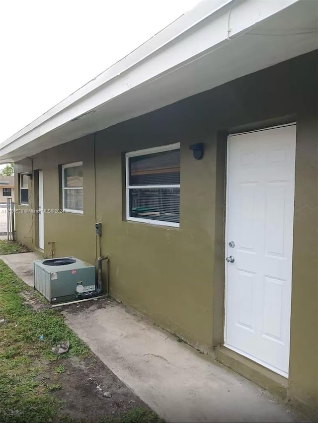 entrance to property featuring central air condition unit