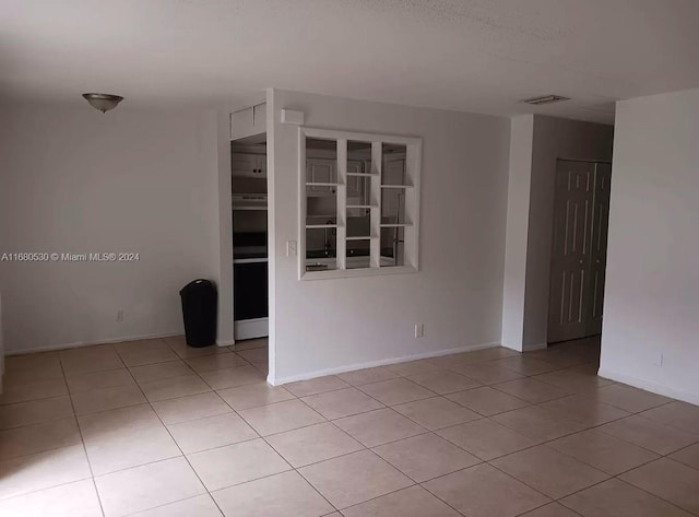 view of tiled spare room