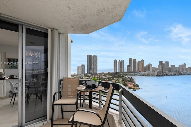 balcony featuring a water view