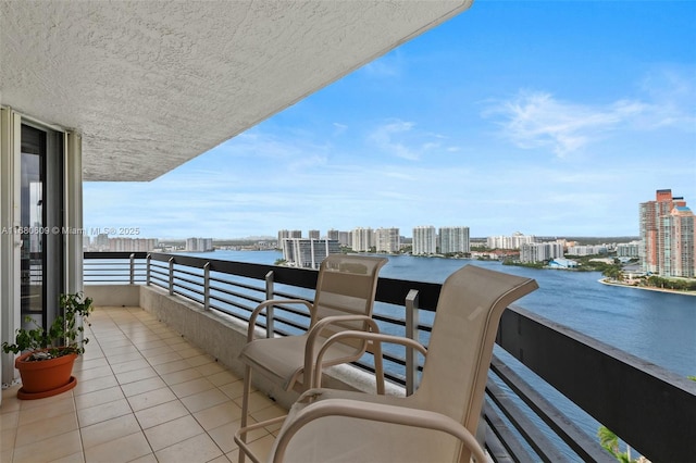 balcony featuring a water view