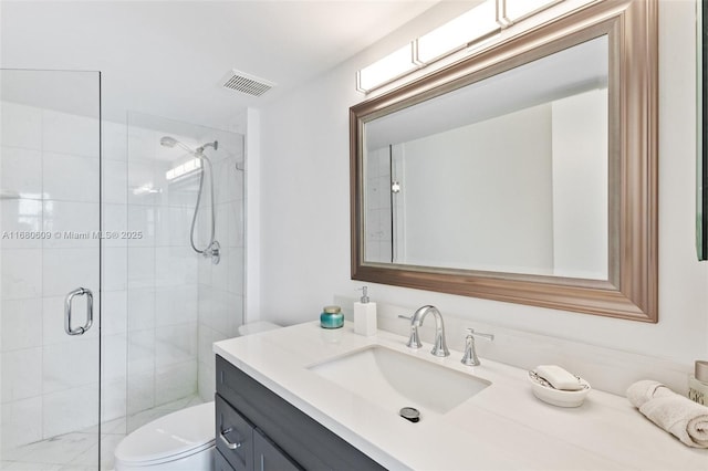 bathroom featuring vanity, toilet, and walk in shower