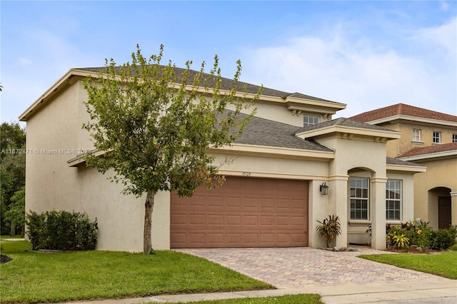 view of front facade with a garage and a front yard