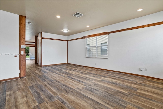 unfurnished room with dark hardwood / wood-style floors