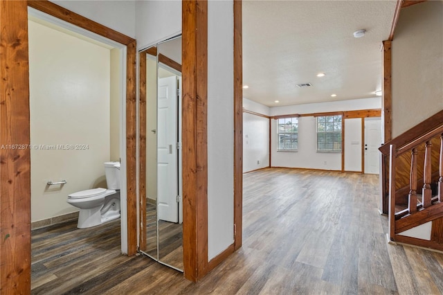 foyer with dark hardwood / wood-style floors