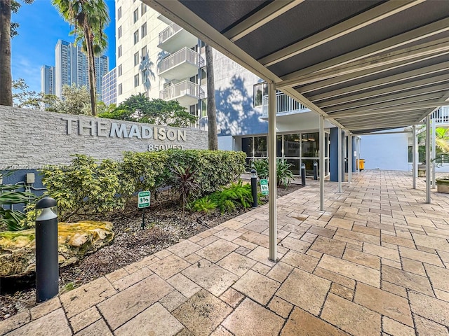 view of patio featuring a balcony