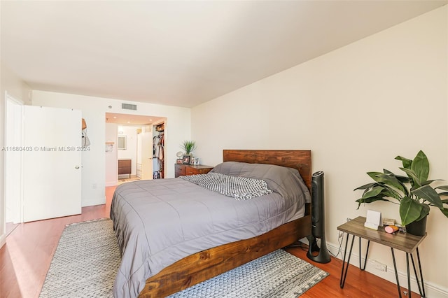 850 N Miami Ave Unit W-906, Miami, FL 33136 - bedroom with wood finished floors and ensuite bath