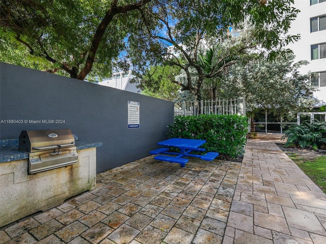 850 N Miami Ave Unit W-906, Miami, FL 33136 - view of patio with an outdoor kitchen