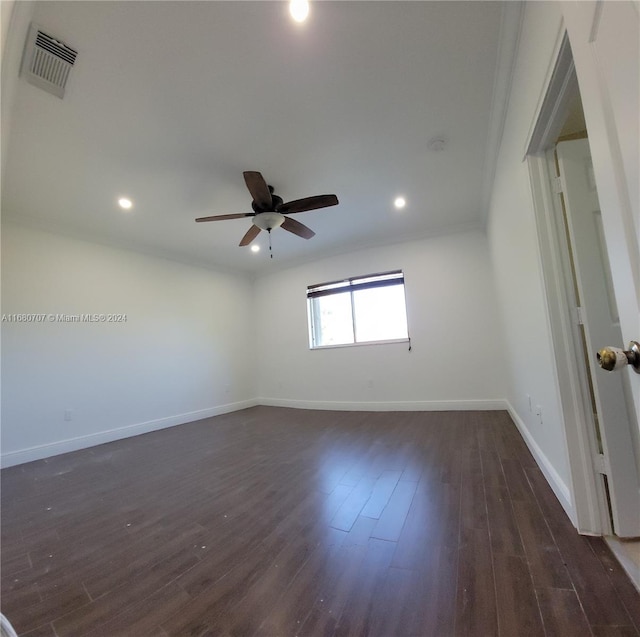 unfurnished room featuring ceiling fan and dark hardwood / wood-style flooring