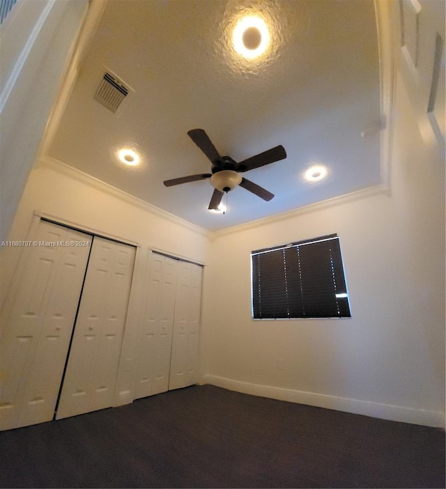 unfurnished bedroom with a textured ceiling, ceiling fan, and crown molding