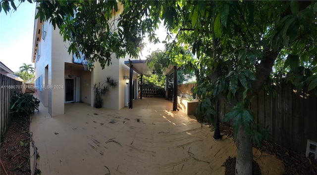 view of side of home featuring a patio area