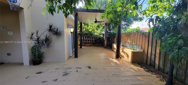 view of patio / terrace featuring ceiling fan