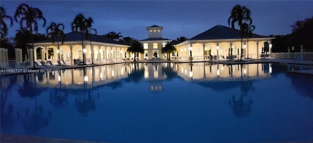 view of pool at night