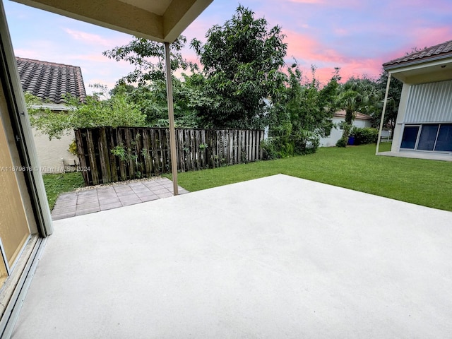 patio terrace at dusk with a yard