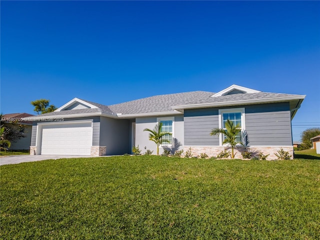 ranch-style home with a front lawn, a garage, and driveway