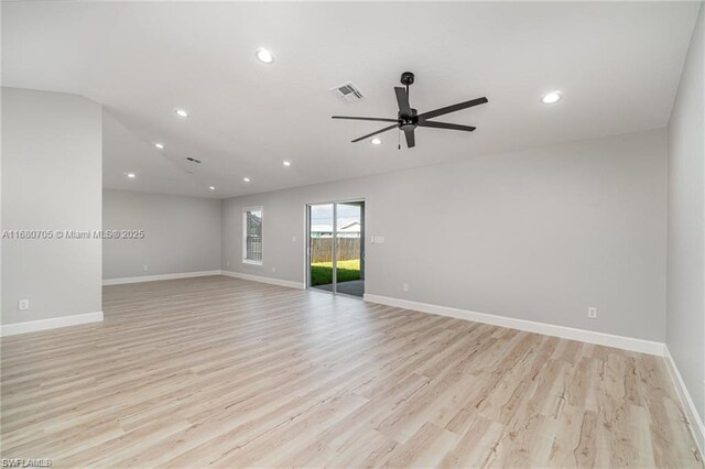 spare room featuring light hardwood / wood-style flooring and ceiling fan