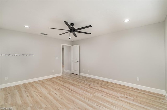 empty room featuring light wood-type flooring, visible vents, recessed lighting, baseboards, and ceiling fan