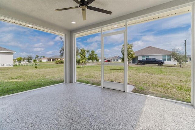 view of patio featuring ceiling fan