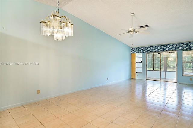 tiled empty room with high vaulted ceiling, a textured ceiling, and ceiling fan with notable chandelier