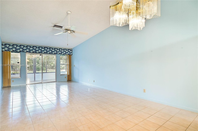 empty room featuring high vaulted ceiling, a textured ceiling, light tile patterned floors, and ceiling fan with notable chandelier