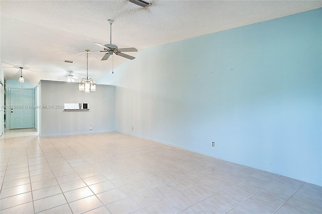 unfurnished room with ceiling fan, high vaulted ceiling, a textured ceiling, and light tile patterned floors