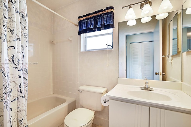 full bathroom with vanity, toilet, and shower / bath combo with shower curtain