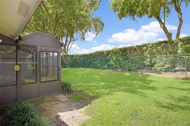 view of yard with a sunroom