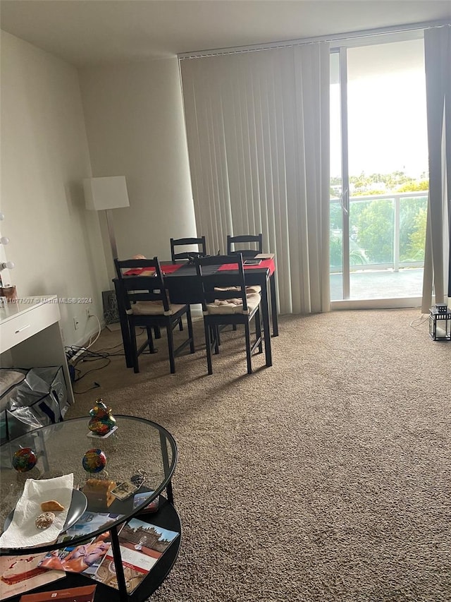 view of carpeted dining area