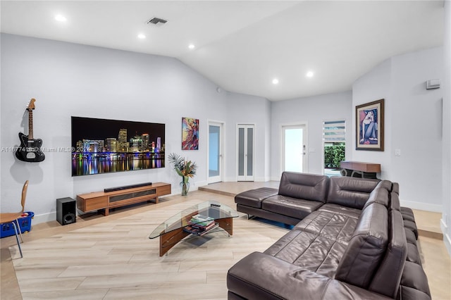 living room featuring vaulted ceiling