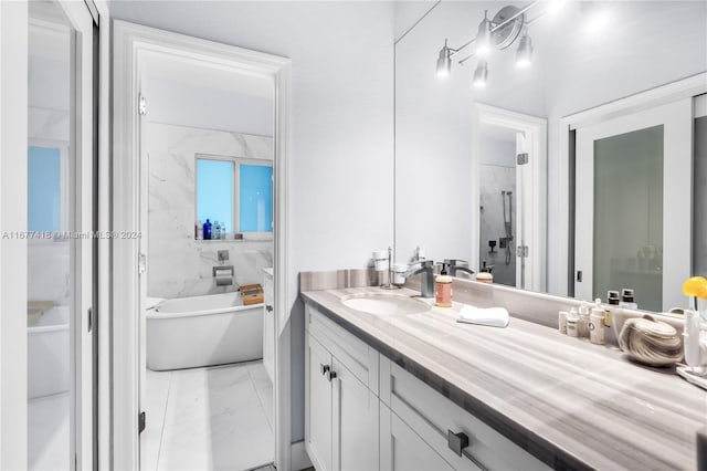 bathroom with vanity and independent shower and bath