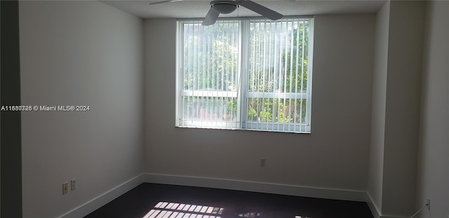 unfurnished room with ceiling fan