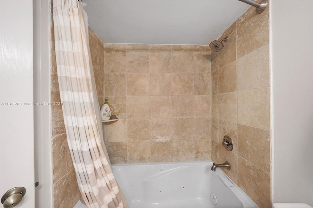 bathroom featuring shower / tub combo with curtain