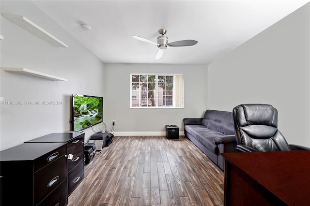 living room featuring wood-type flooring and ceiling fan