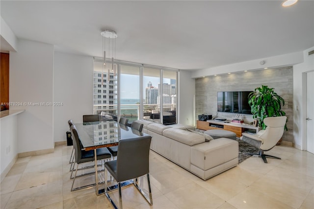 living room featuring floor to ceiling windows