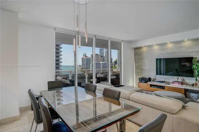 dining room with light tile patterned floors and floor to ceiling windows