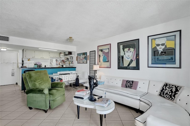 tiled living room with a textured ceiling