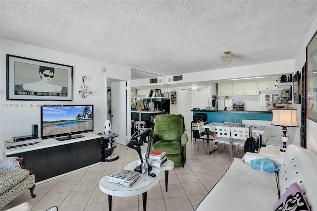 tiled living room with a textured ceiling