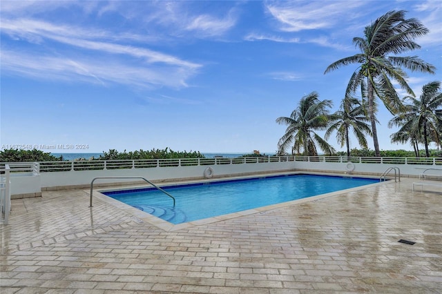 view of swimming pool featuring a patio area