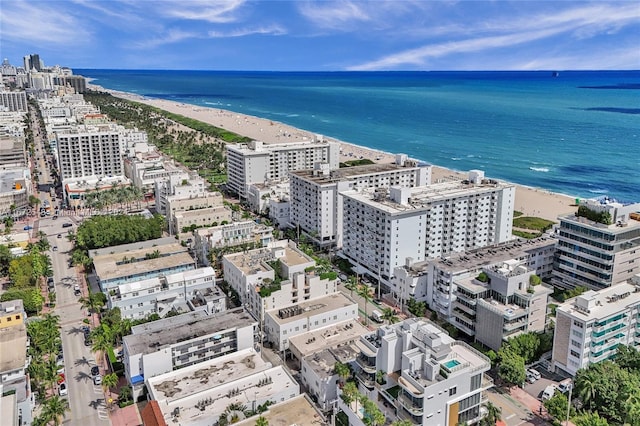 bird's eye view featuring a water view and a view of the beach