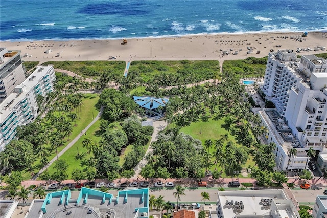 bird's eye view featuring a view of the beach and a water view