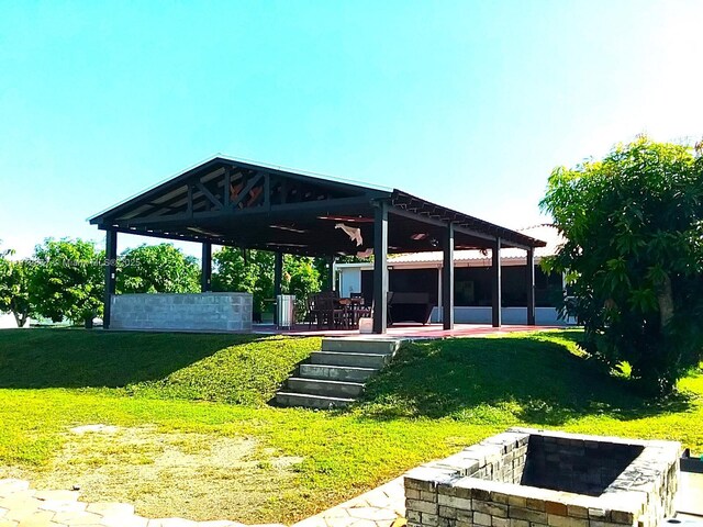 exterior space featuring ceiling fan and a gazebo