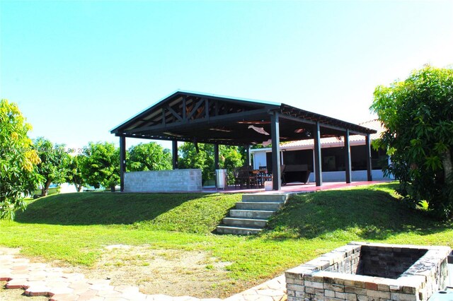 surrounding community with a yard, a gazebo, and a patio area