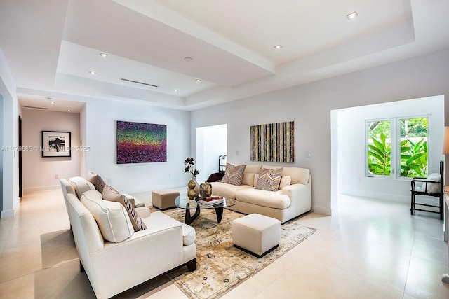 living room with a raised ceiling