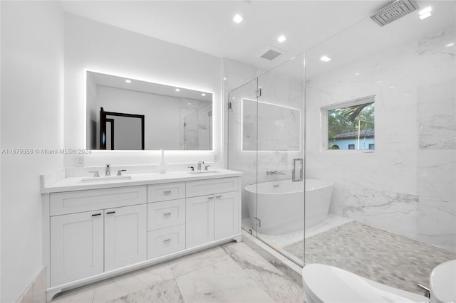 full bathroom with vanity, toilet, tile walls, and independent shower and bath