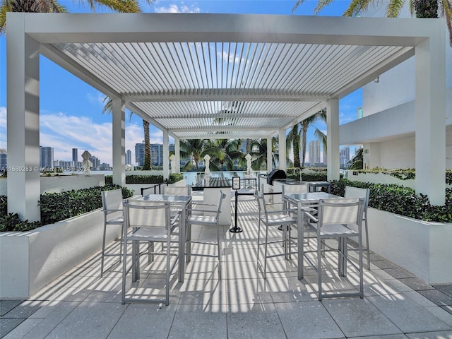 view of patio / terrace with a pergola and ceiling fan