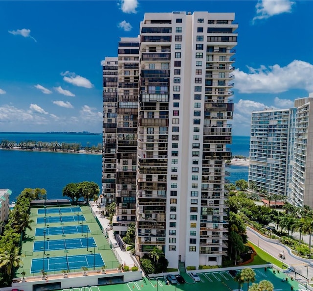 view of building exterior with a water view