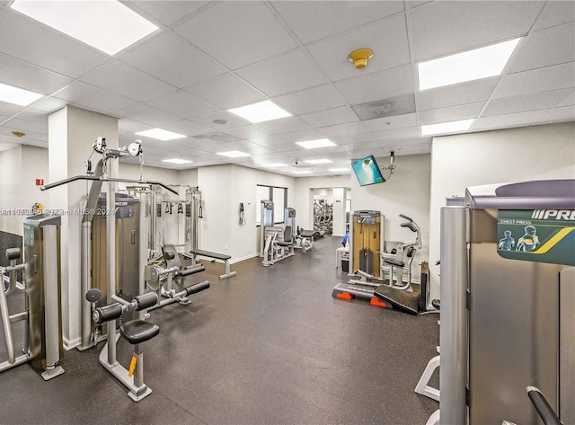 exercise room with a drop ceiling