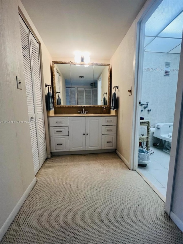 bathroom with vanity, a bidet, and toilet