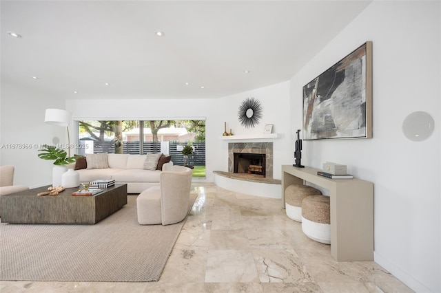 living room with a tile fireplace