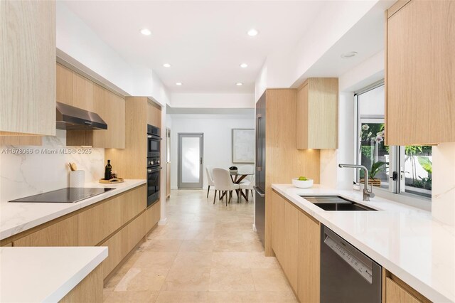 kitchen featuring black appliances, light brown cabinets, tasteful backsplash, sink, and ventilation hood